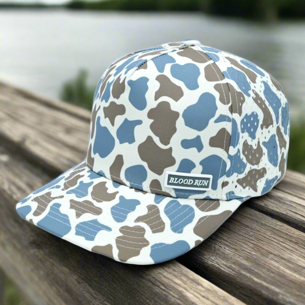Camouflage-patterned cap with 'Blood Run' logo on a white background