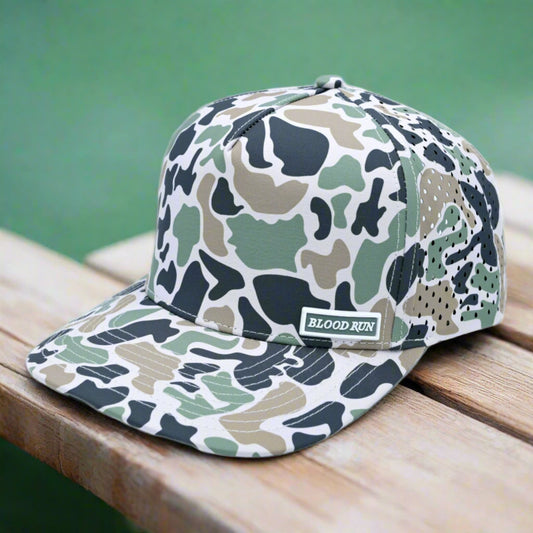 Camouflage-patterned cap with 'BLOOD RUN' logo on a white background